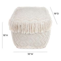 a white poufce with fringes and measurements