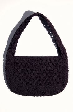 a crocheted black purse is shown against a white background, with the handle partially closed