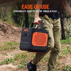 a man carrying an orange and black portable radio on his back with the words ease of use portabiity easy to set up, press & play