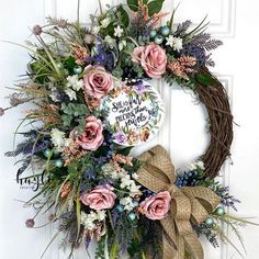 a wreath with pink flowers and greenery on it, next to the words bible scripture wreath provers 31 10