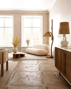 a living room filled with lots of furniture next to two large windows on the wall