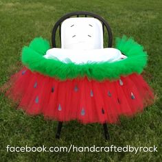 a red and green watermelon tutu skirt sitting on top of a chair