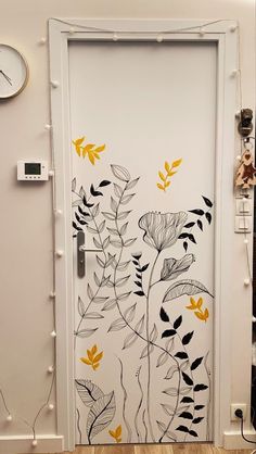 a white door with yellow flowers painted on it