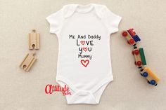 This is the perfect birthday, Christmas or Mother's Day gift from your cute little one to their Mother.  With our overall 4.9 star rating and over 1500 reviews, you can be confident in your purchase, especially with our fast turnaround. Our white baby bodysuits are made from 100% cotton.  Available in Premature, Newborn and up to 18-24 months and in 5 different colours Please take a look at the rest of our items in our shop! All available with international delivery and free delivery in the UK. Personalized Cute Onesie For First Birthday, Customizable Cute Onesie For Birthday, Cute Customizable Onesie For Birthday, Cute White Onesie For Father's Day, Cute Personalized Onesie For Birthday, Cute Onesie With Letter Print For Gift, Father's Day Gift Onesie With Letter Print, Cute Onesie With Name Print As A Gift, Cute Onesie For Playtime On Mother's Day