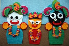 three puppets are made to look like they have been dressed in different colors and patterns