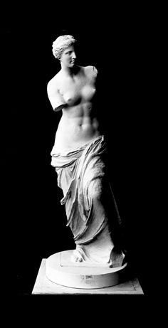 a black and white photo of a statue