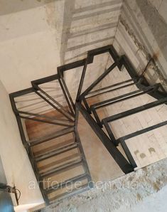 a spiral staircase in an abandoned building