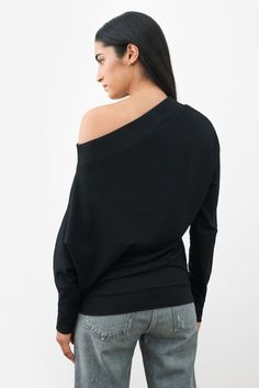 Introducing our Lauren Sweatshirt — a fusion of minimalism and casual elegance. Her design features an off-the-shoulder neckline, playfully asymmetric long sleeves, and a relaxed fit that delivers a polished, yet laid-back feel. Crafted from lightweight and breathable European French Terry, Lauren's a unique sweatshirt top that embodies effortless chic. | Sam is 5'8" (173 cm) tall, wearing size XS. Astrid, in off white, is 5'9" (175 cm) tall, wearing size XS. Total length taken from the center b Oversized Off-shoulder Loungewear Top, Modern Relaxed Fit Top With Drop Shoulder, Modern Tops With Relaxed Fit And Drop Shoulder, Modern Relaxed Fit Tops For Loungewear, Chic Oversized Off-shoulder Top, Versatile One Shoulder Top For Fall, Versatile One-shoulder Top For Fall, Oversized Off-shoulder Cotton Top, Casual Black One Shoulder Long Sleeve Top