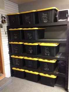 the shelves are filled with black and yellow bins