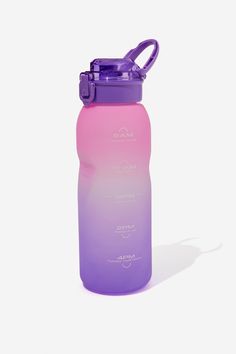 a purple and pink water bottle sitting on top of a white surface