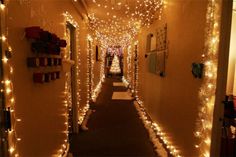 the hallway is decorated with christmas lights and garlands