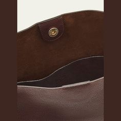 Il Bisonte "Snodo" crossbody bag in leather  Adjustable knot crossbody strap, 10.7" drop Can be worn as a shoulder or crossbody bag  Open top with snap closure  Interior, one slip pocket  Lining: Suede Approx. 13"H x 11.8"W x 3.9"D Item Weight (Lbs.): 1.7 Made in Italy Adjustable Knot, Open Top, Crossbody Strap, Leather Crossbody Bag, Leather Crossbody, Snap Closure, Knot, Crossbody Bag, Tops Designs