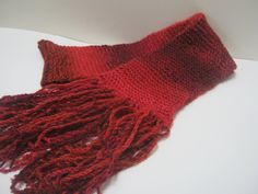 Handmade long knit scarf. Red knitted scarf. Size 5 " X 63" inches. Ready to ship. This nice hand knit scarf. is so soft and warm. I love all the shades of red. will be great with black or dark blue coat or any of your out fits. Makes for a nice gift also. Check out my shop for other colors. When I was 6 years old, I took 4H knitting. I won first place for my mittens. I have been knitting ever since making up my own patters. and selling my scarves at shows. I fined knitting very relaxing. Feel f Red Winter Scarf, Red Scarf Winter, Dark Blue Coat, Scarf Knitted, Hand Knit Scarf, Blue Coat, Blue Coats, Long Knit, Scarf Gift