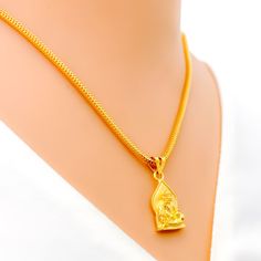 This attractive pendant, exquisitely crafted from 22k gold and weighing 3.2 grams, features a finely engraved depiction of Sai Baba set against a luminous yellow gold finish. The pendant has a length of 0.9 inches, making it both noticeable and modest in size, ideal for daily wear. Perfect for devotees who wish to keep Sai Baba close to their hearts, this pendant combines spiritual devotion with elegant craftsmanship, offering a timeless piece that embodies grace and serenity. PRODUCT DETAILS Gold Purity(karat): 22k Gold Weight(grams): 3.2 Item Finish: Yellow Gold Pendant Length: 0.9" Chain: Not Included 22k Gold Spiritual Jewelry Gift, Spiritual 22k Yellow Gold Jewelry, Spiritual 22k Yellow Gold Necklaces, Spiritual 22k Gold Engraved Jewelry, 22k Gold Necklaces For Puja, Yellow Gold Locket For Puja, Gold Plated Locket For Puja, Spiritual Gold Plated Temple Necklace As Gift, 22k Gold Spiritual Pendant Necklace