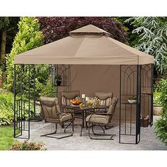 an outdoor gazebo with chairs and tables