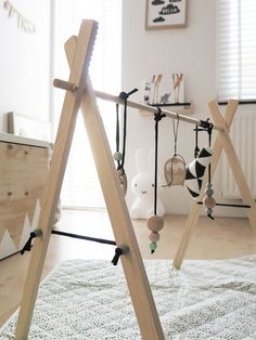 a child's room with a wooden teepee