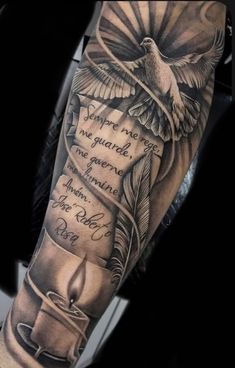 a man's arm with a bird and candle tattoo on it