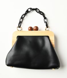 Black & Wood Leatherette Handbag - Unique Vintage - Womens, ACCESSORIES, HANDBAGS Chic Black Bag With Bamboo Handle, Formal Black Shoulder Bag With Bamboo Handle, Elegant Black Shoulder Bag With Bamboo Handle, Black Satchel Shoulder Bag With Bamboo Handle, Everyday Black Shoulder Bag With Bamboo Handle, Brown Bags With Wooden Handle For Everyday Use, Timeless Classic Style, Golden Chain, Halloween News