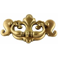 an ornate brass door handle on a white background