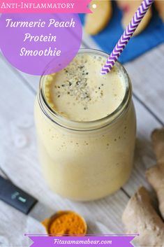 a smoothie in a mason jar with a purple and white striped straw next to it