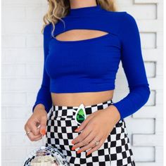 Get Ready For Lots Of Blue This Fall! This Royal Blue Longsleeve Top Is Sure To Make You Feel Like A Star With Its Saturated Color And Cute Out. It Also Has A Mock Neck And A Cropped Fit. Seen Paired With The Never Have I Ever Checkered Mini Skirt. True To Size. Model Is 5'7 80% Polyester 14% Rayon 6% Spandex Blue Long Sleeve Crop Top For Night Out, Blue Cropped Top For Fall, Blue Stretch Crop Top For Fall, Blue Long Sleeve Trendy Crop Top, Trendy Blue Long Sleeve Crop Top, Blue Casual Crop Top For Night Out, Casual Blue Crop Top For Night Out, Open Crop Top, Checkered Mini Skirt