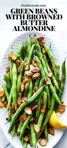 green beans with almonds on a white plate