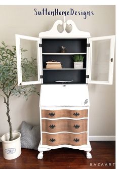 an old dresser has been painted white and is next to a small potted plant