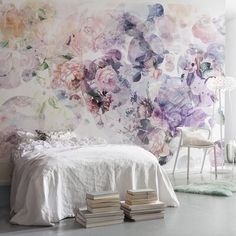 an image of a bedroom setting with flowers on the wall