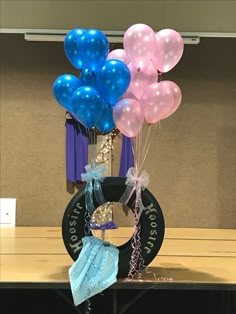 balloons and diapers are arranged on a table