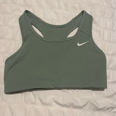 Brand New Nike Sports Bra Never Worn Before. I Took The Tags Off Before Trying It On And It Didn’t Fit Me. Very Pretty Green And Comfortable Unlined Interior. Bundle With Other Items In My Closet To Save!! Casual Green Sports Bra With Light Support, Green Casual Sports Bra For Light Exercise, Casual Green Sports Bra For Light Exercise, Sporty Green Top With Light Support, Nike Solid Color Sports Bra, Casual Green Sports Bra, Sweat Resistant, Green Casual Sports Bra, Casual Green Sports Bra, Casual Green Sweat-resistant Sports Bra