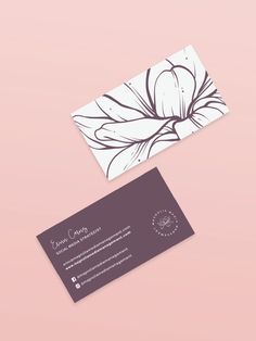 two business cards with black and white designs on them, one has an image of a flower