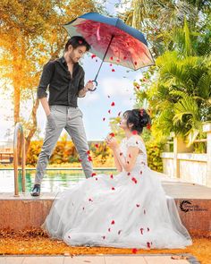 a man standing next to a woman holding an umbrella in front of her on the ground