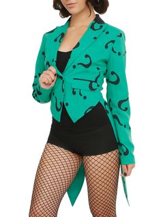 a woman in fishnet tights and a green blazer with black letters on it