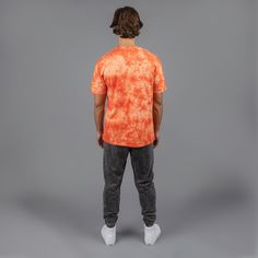 Is it just us, or can you also see this in a music video? This color pops off, just like you - Our bold orange tie-dye t-shirt will jumpstart your evolution. Features 100% cotton for exceptional comfort Original Metal Umbrella logo on the front Woven neck tag Fit Female model is 5'2" and is wearing a size XS Male model is 6'3" and is wearing a size L Tie-dye Short Sleeve T-shirt For Streetwear, Tie Dye T-shirt For Streetwear, Hand Dyed Crew Neck T-shirt For Streetwear, Umbrella Logo, Fit Female, Orange Tie Dye, Monogram T Shirts, Orange Tie, No Image