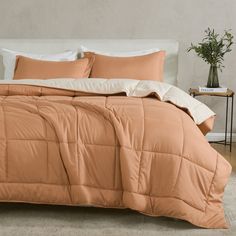 the comforter is made up and ready for someone to use it in their bed