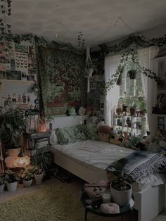 a bed room with a neatly made bed and lots of plants