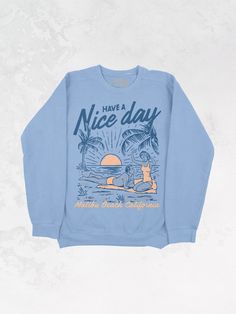 Get all of the summer-y vibes in this oversized Malibu Beach, California inspired sweatshirt!- Features the phrase "Have A Nice Day" across the top with a man and woman lying on a beach & "Malibu Beach, California" underneath it all in a navy and peach ink- Screen print transfer that is individually heat pressed onto each sweatshirt- Vintage washed sweatshirt that gets softer after every wash- Oversized fit- Sizing Translation: XS/S = M , S/M = L , L/XL = XL . 2XL/3XL = 2XL- 100% Cotton - Model is 5'9" wearing a size 2XL/3XL in the color Sage**due to screens & filters color may vary from pictures** Malibu Beach California, Navy And Peach, Washed Sweatshirt, 90s Sports, Malibu Beach, Screen Print Transfer, Malibu Beaches, Print Transfer, Western Chic