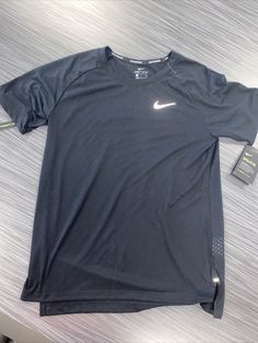 NIKE RUNNING T Shirt DRI-FIT NEW W/TAGS Reflective Women’s SMALL Black SWOOSH. Pit to pit measures 17 inches Length is 24 inches Nike Dri-fit T-shirt For Running, Nike Athleisure Workout T-shirt, Casual Dri-fit Short Sleeve Activewear, Moisture-wicking Tops For Streetwear, Moisture-wicking Dri-fit Tops For Streetwear, Nike Dri-fit Breathable Tops, Nike Breathable Sportswear T-shirt, Nike Sportswear Breathable T-shirt, Nike Breathable Athletic Fit Tops