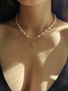 Make a statement with our gorgeous pearl initial necklace - a delicate fusion of sophistication and personal touch that transcends trends and captures hearts. This dainty pearl necklace with sparkling gold letter pendant is more than just jewelry; it's a reflection of your individuality. Adorn yourself with a dainty pearl letter pendant that carries the initial of your name, creating a one-of-a-kind piece that resonates with your personality. The freshwater pearls, handpicked for their radiant g Pearl Letter Necklace, Pearl Initial Necklace, Diy Initial Necklace, Letter A Necklace, Gold Letter Pendants, Letter Necklace Initials, Necklace Girlfriend, Girlfriend Necklace, Dainty Pearl Necklace