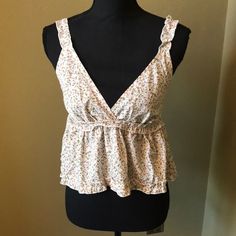 Adorable Floral 100% Polyester Crop Tank Top. Scrunched Shoulder Straps And Cute Ruffle Under Chest. Straps And Under Chest Have Elastic. Tags: Summer, Spring, Cruise, Disney, Floral, Easter, Dressy, Casual, Tank Top, Sleeveless, Crop Top, Tunic, Blouse, Cruise Disney, Cream Blouse, Crop Tank Top, Floral Tank Top, Floral Tank, Sleeveless Crop Top, Green Cream, Lace Tank Top, Tunic Blouse