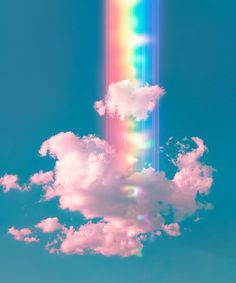 a rainbow in the sky with clouds