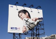 a billboard with an image of a man holding a white object in his hand and the words formula written on it