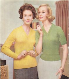 two women standing next to each other in front of a mirror wearing yellow and green sweaters