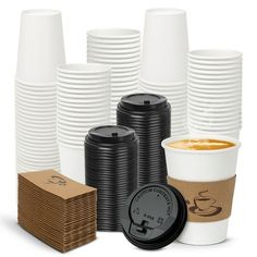 a stack of coffee cups next to stacks of cardboard boxes and paper napkins on a white background