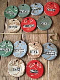 several different colored tags are on a wooden table