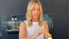 a woman is eating an ice cream sundae