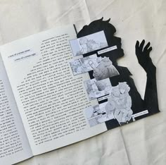 an open book with black and white images on it