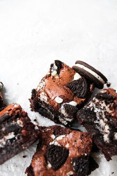 several cookies and oreo brownies sitting on top of each other next to one another