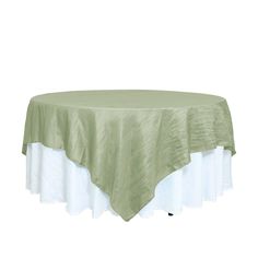 a round table with a green and white cover