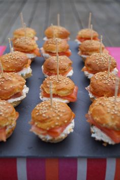 several mini sandwiches with toothpicks in them